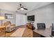 Home office setup with a desk, chair, entertainment center, and plenty of space at 2548 E Compton St, Orlando, FL 32806