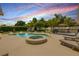 Inviting backyard with a pool, hot tub, sundeck, and mature landscaping at 2548 E Compton St, Orlando, FL 32806
