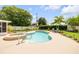 Beautiful backyard oasis with a sparkling pool, hot tub, lush landscaping, and comfortable seating for relaxation at 2548 E Compton St, Orlando, FL 32806