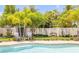Inviting backyard pool area with lush landscaping, comfortable seating, and a charming storage shed for outdoor essentials at 2548 E Compton St, Orlando, FL 32806