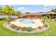 Beautiful pool surrounded by landscaping, with lounge area, patio and well-manicured lawn at 2548 E Compton St, Orlando, FL 32806