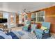 Cozy sunroom with tile floors, comfortable chairs, ceiling fan and brick exterior at 2548 E Compton St, Orlando, FL 32806