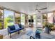 Cozy sunroom filled with natural light, comfortable seating, and views of the pool at 2548 E Compton St, Orlando, FL 32806