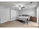 Inviting bedroom with a comfortable bed, soft lighting, and stylish wood flooring at 2713 Needle Palm Dr, Edgewater, FL 32141