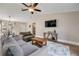 A beautifully styled living room includes a view of the breakfast bar and features vaulted ceilings at 2713 Needle Palm Dr, Edgewater, FL 32141