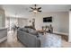 Spacious living room with a ceiling fan, comfortable seating, and a dining area with backyard access at 2713 Needle Palm Dr, Edgewater, FL 32141