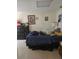 Bright bedroom featuring a large window, tiled flooring, and ample storage, a great private space at 2725 Travelers Palm Dr, Edgewater, FL 32141