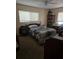 Comfortable bedroom with a large window, a ceiling fan, and ample space, creating a serene retreat at 2725 Travelers Palm Dr, Edgewater, FL 32141