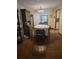 Cozy dining room featuring classic wooden furniture, a chandelier, and views of the outdoor area at 2725 Travelers Palm Dr, Edgewater, FL 32141