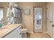 The bathroom features a double vanity, a toilet, and a door to an outside patio at 2913 Linari Ct, New Smyrna Beach, FL 32168