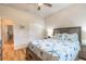 Charming bedroom with light wood floors, coastal decor and ceiling fan at 2913 Linari Ct, New Smyrna Beach, FL 32168