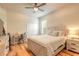 Inviting bedroom with wood floors, a ceiling fan, and a neutral color palette at 2913 Linari Ct, New Smyrna Beach, FL 32168