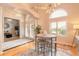 Stylish dining area with modern lighting, a round table, and shuttered windows at 2913 Linari Ct, New Smyrna Beach, FL 32168