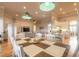 Open dining area with modern lighting and easy access to living room and the updated kitchen at 2913 Linari Ct, New Smyrna Beach, FL 32168