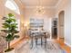 Bright dining room with stylish chandelier, high ceilings, and modern decor at 2913 Linari Ct, New Smyrna Beach, FL 32168
