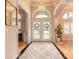 Grand foyer with high ceilings, arched windows, and decorative lighting at 2913 Linari Ct, New Smyrna Beach, FL 32168