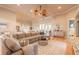 Bright living room with a large sectional, stylish rug, and modern decor for comfortable living at 2913 Linari Ct, New Smyrna Beach, FL 32168