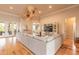 Spacious living room featuring a modern ceiling fan, hardwood floors, and large sectional sofa at 2913 Linari Ct, New Smyrna Beach, FL 32168