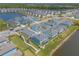 Stunning aerial view of a new residential community with beautiful landscaping and serene pond views at 3136 Portofino Blvd, New Smyrna Beach, FL 32168