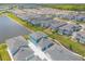An aerial view of the homes, lake, and landscaping of the community at 3136 Portofino Blvd, New Smyrna Beach, FL 32168