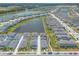 Wide aerial perspective of a Primary-planned community featuring neighborhood ponds, walking trails, and well-manicured lawns at 3136 Portofino Blvd, New Smyrna Beach, FL 32168