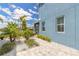 View of the beautifully landscaped backyard and brick-paved area of this stunning home at 3136 Portofino Blvd, New Smyrna Beach, FL 32168