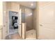 Modern bathroom with a large gray tiled shower and glass door at 3136 Portofino Blvd, New Smyrna Beach, FL 32168