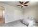 Bedroom with a ceiling fan, closet, carpeted floor, and bed at 3136 Portofino Blvd, New Smyrna Beach, FL 32168