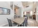 Open-concept dining room and living room with high ceilings and lots of natural light at 3136 Portofino Blvd, New Smyrna Beach, FL 32168