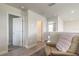 Hallway features neutral paint, wood-look floors, and several white doors at 3136 Portofino Blvd, New Smyrna Beach, FL 32168