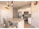 Well-equipped kitchen featuring stainless steel appliances and a large island with barstool seating at 3136 Portofino Blvd, New Smyrna Beach, FL 32168