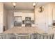 Kitchen features granite counters and stainless appliances plus island seating at 3136 Portofino Blvd, New Smyrna Beach, FL 32168