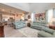 Spacious living room with soaring ceilings open to kitchen, creating a comfortable and connected living space at 3136 Portofino Blvd, New Smyrna Beach, FL 32168