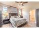 Cozy main bedroom with a ceiling fan, a large bed, and matching nightstands at 3136 Portofino Blvd, New Smyrna Beach, FL 32168