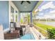Relaxing screened-in patio featuring comfortable seating and serene water views for outdoor enjoyment at 3136 Portofino Blvd, New Smyrna Beach, FL 32168