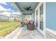 Relaxing screened porch featuring comfortable seating and a ceiling fan at 3136 Portofino Blvd, New Smyrna Beach, FL 32168