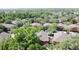 Birds-eye-view of a community featuring beautiful two-story townhomes surrounded by mature trees and landscaping at 3311 Pine Oak Trl, Sanford, FL 32773