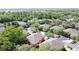 Aerial shot of a townhome community, surrounded by verdant trees, offering a serene and picturesque living environment at 3311 Pine Oak Trl, Sanford, FL 32773