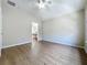 Bedroom with wood flooring and bathroom ensuite access at 3311 Pine Oak Trl, Sanford, FL 32773