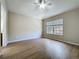 Bright bedroom with wood floors, fan and a large window at 3311 Pine Oak Trl, Sanford, FL 32773