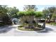 Entrance to the community with manicured landscaping and signage at Magnolia Park at 3311 Pine Oak Trl, Sanford, FL 32773