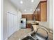 Bright kitchen with stainless steel appliances and spacious countertops at 3311 Pine Oak Trl, Sanford, FL 32773