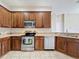 Well-equipped kitchen featuring stainless steel appliances and ample cabinet space at 3311 Pine Oak Trl, Sanford, FL 32773