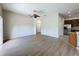 Spacious living room featuring wood flooring and a ceiling fan at 3311 Pine Oak Trl, Sanford, FL 32773