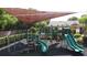 Playground featuring slides, climbing structures, and a shaded area at 3311 Pine Oak Trl, Sanford, FL 32773