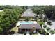 Aerial view of the community pool and cabana surrounded by homes and mature trees at 3311 Pine Oak Trl, Sanford, FL 32773