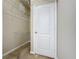 The walk-in closet has metal storage shelves and a white door with gold hardware at 3311 Pine Oak Trl, Sanford, FL 32773