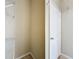 This is a walk-in closet with metal storage shelves and a door that is slightly ajar at 3311 Pine Oak Trl, Sanford, FL 32773