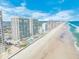 Picturesque aerial of Daytona Beach featuring shoreline condos, beach, pools and breathtaking ocean views at 3311 S Atlantic Ave # 801, Daytona Beach, FL 32118