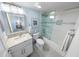 Modern bathroom with a glass shower and a light gray and white color scheme at 3311 S Atlantic Ave # 801, Daytona Beach, FL 32118